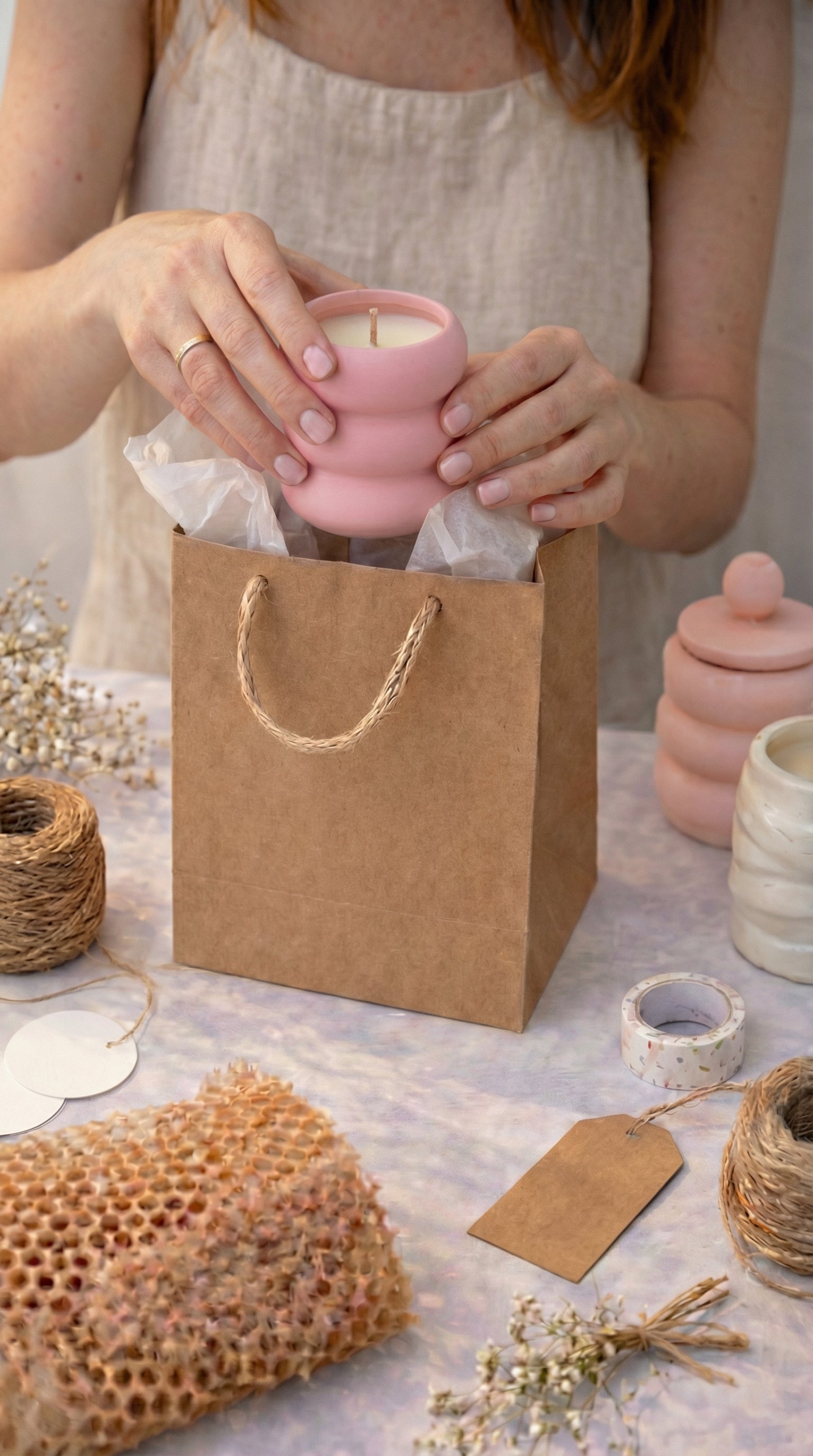 Finished handmade candle being packaged after a candle-making experience in Orlando