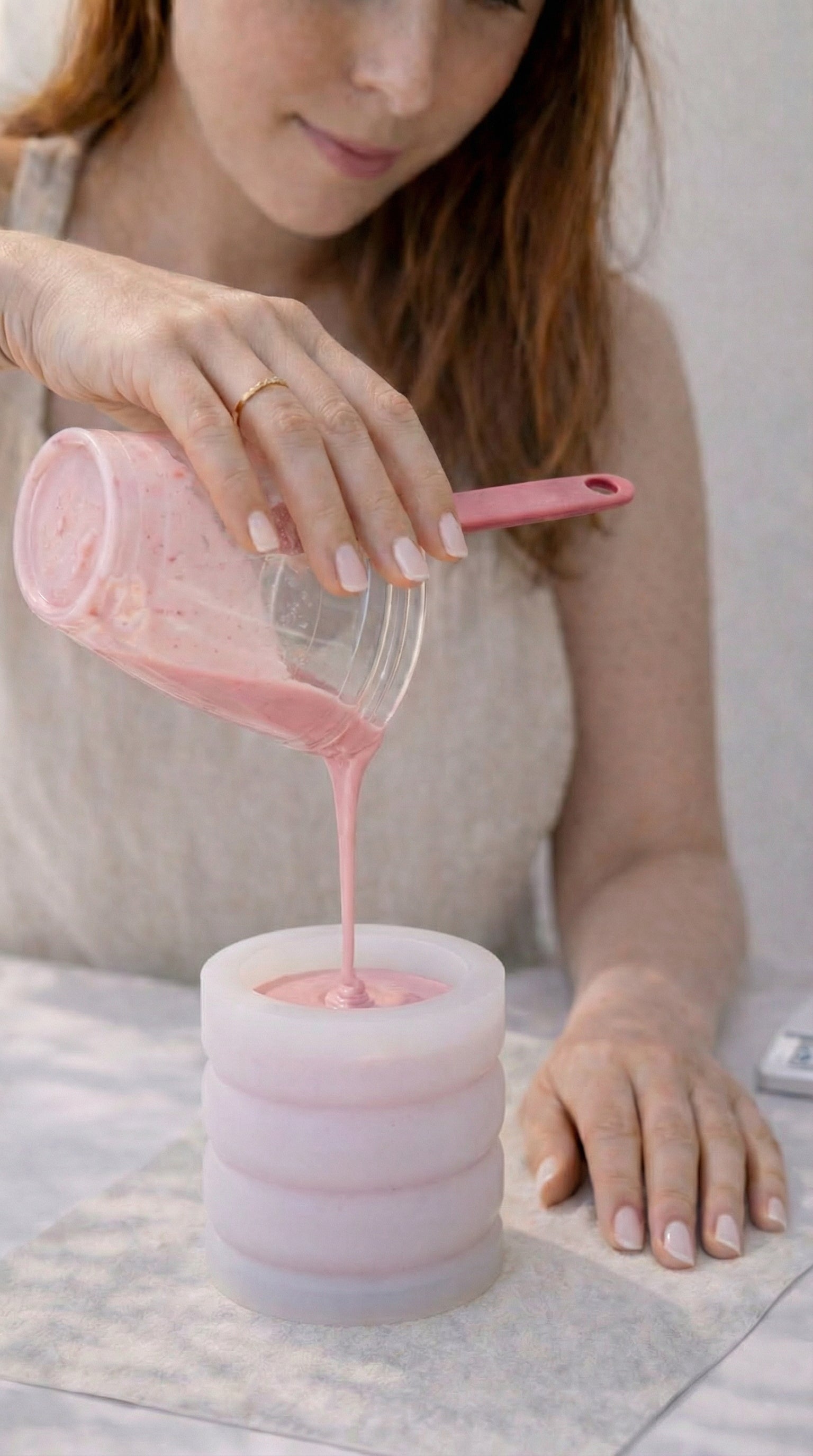Mixing mineral compound to create a handmade candle vessel during a private candle workshop in Orlando