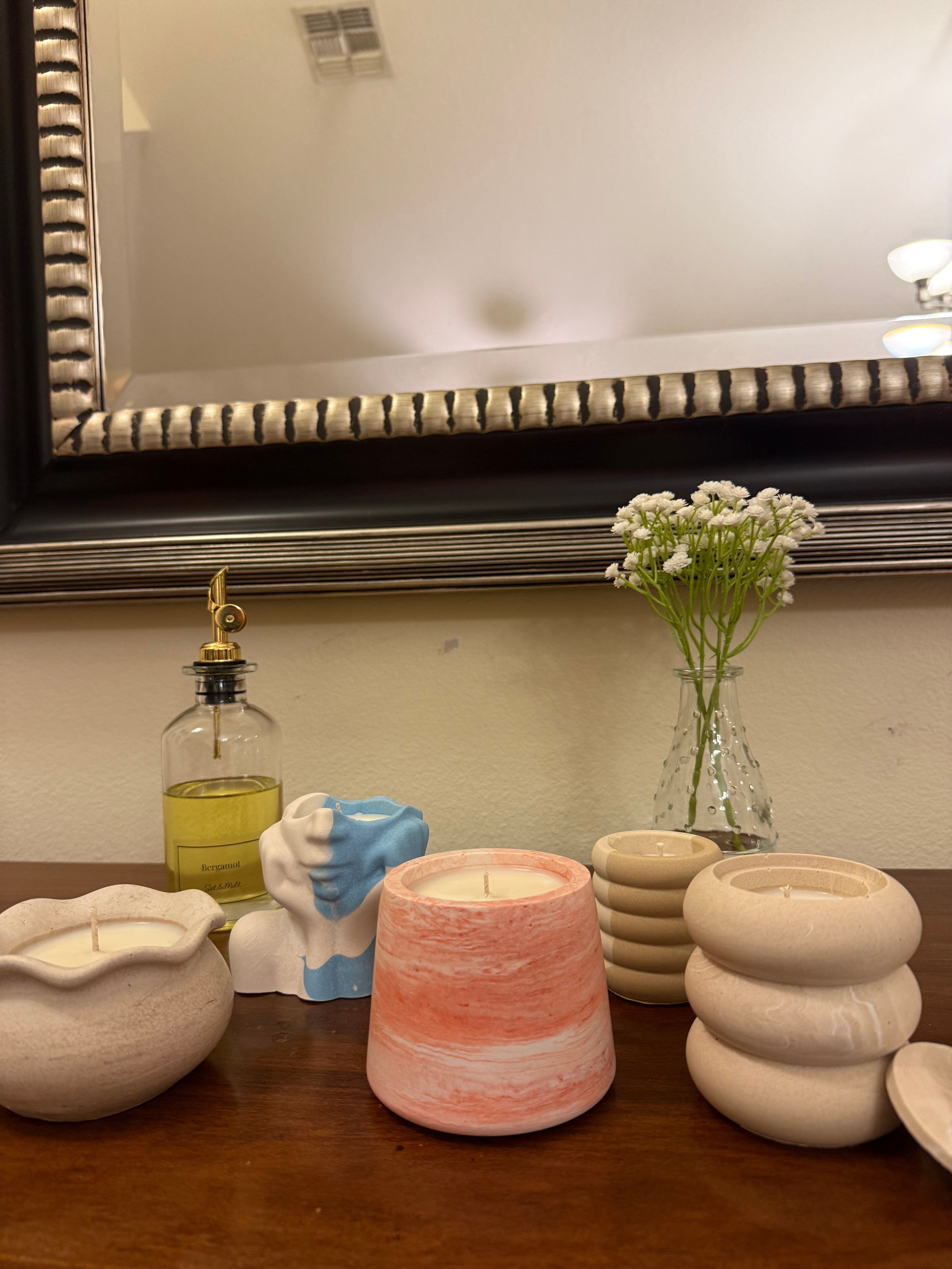 Handmade candle vessels created during a Set & Melt candle making workshop in Orlando, designed as custom home decor pieces.